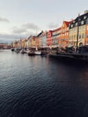 The coloured houses of Nyhavn in Copenhagen, by the water.
